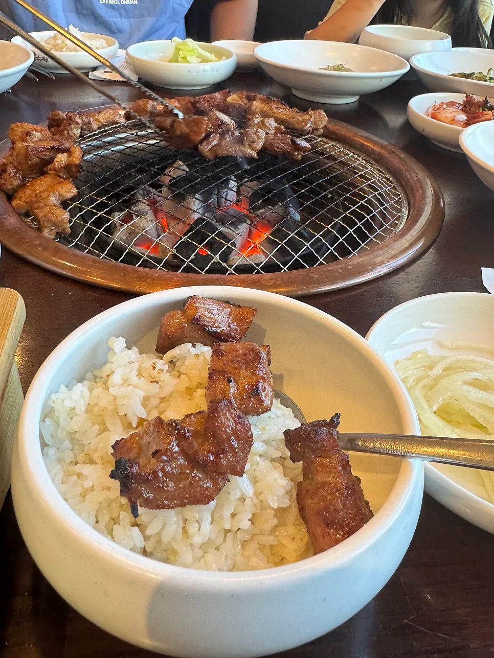 Warm hwangmi pot rice served with side dishes