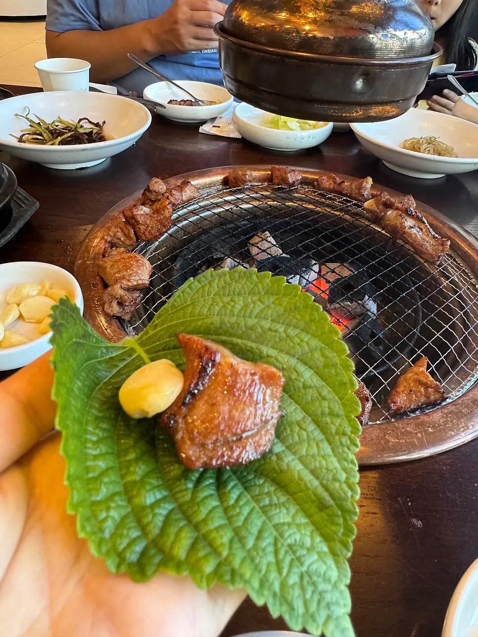 A lettuce wrap with pork galbi and vegetables