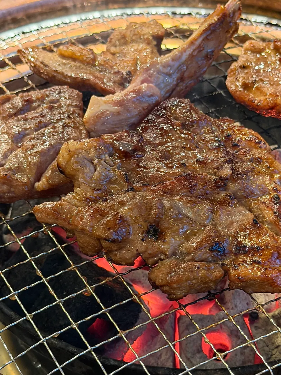 Nuruk-aged pork galbi mokssal being grilled