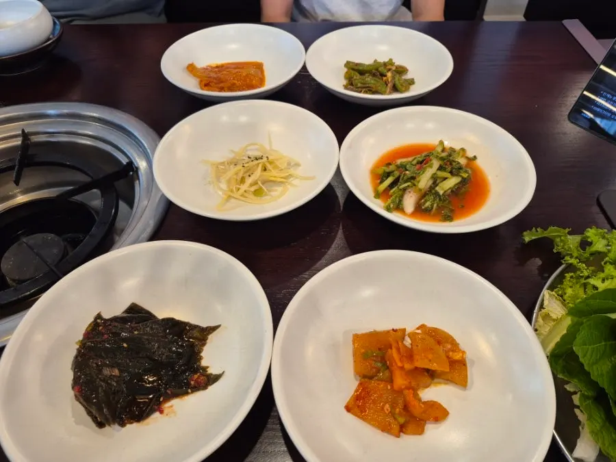 Plate of namul and japchae side dishes