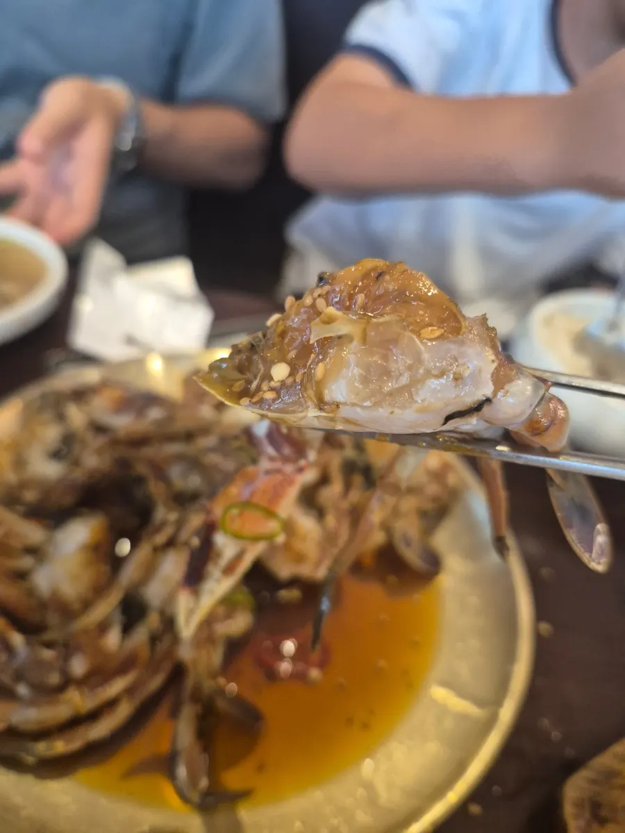 Soy crab served with a bowl of rice