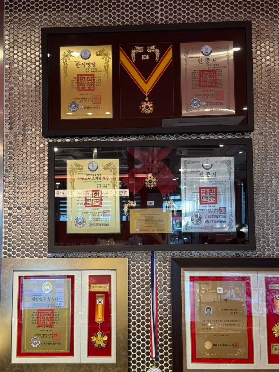 Korean cuisine master certificates and awards on the wall