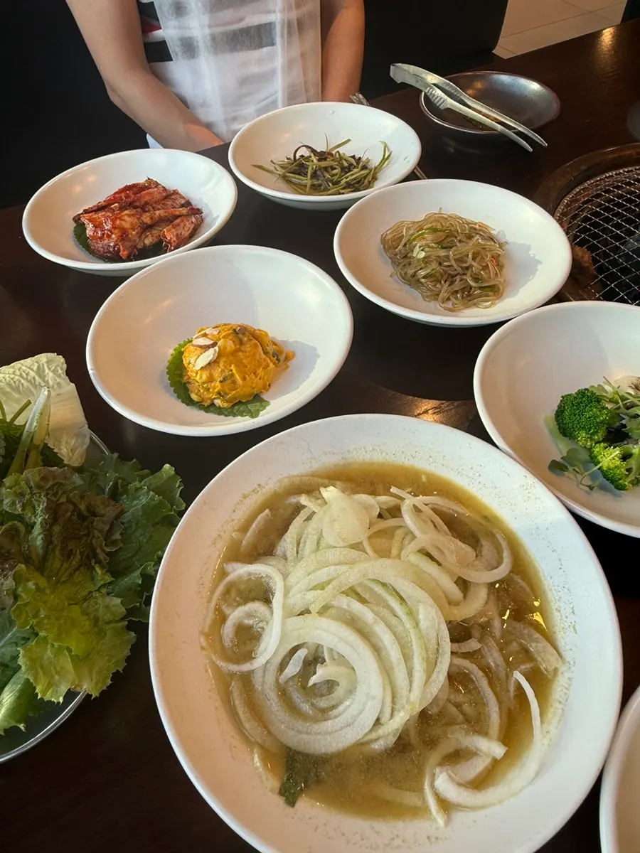 A full spread of assorted side dishes set on the table