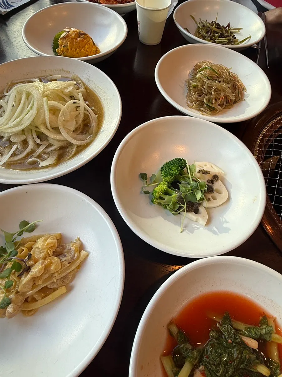 A plate of unfamiliar side dishes we hadn't tried before