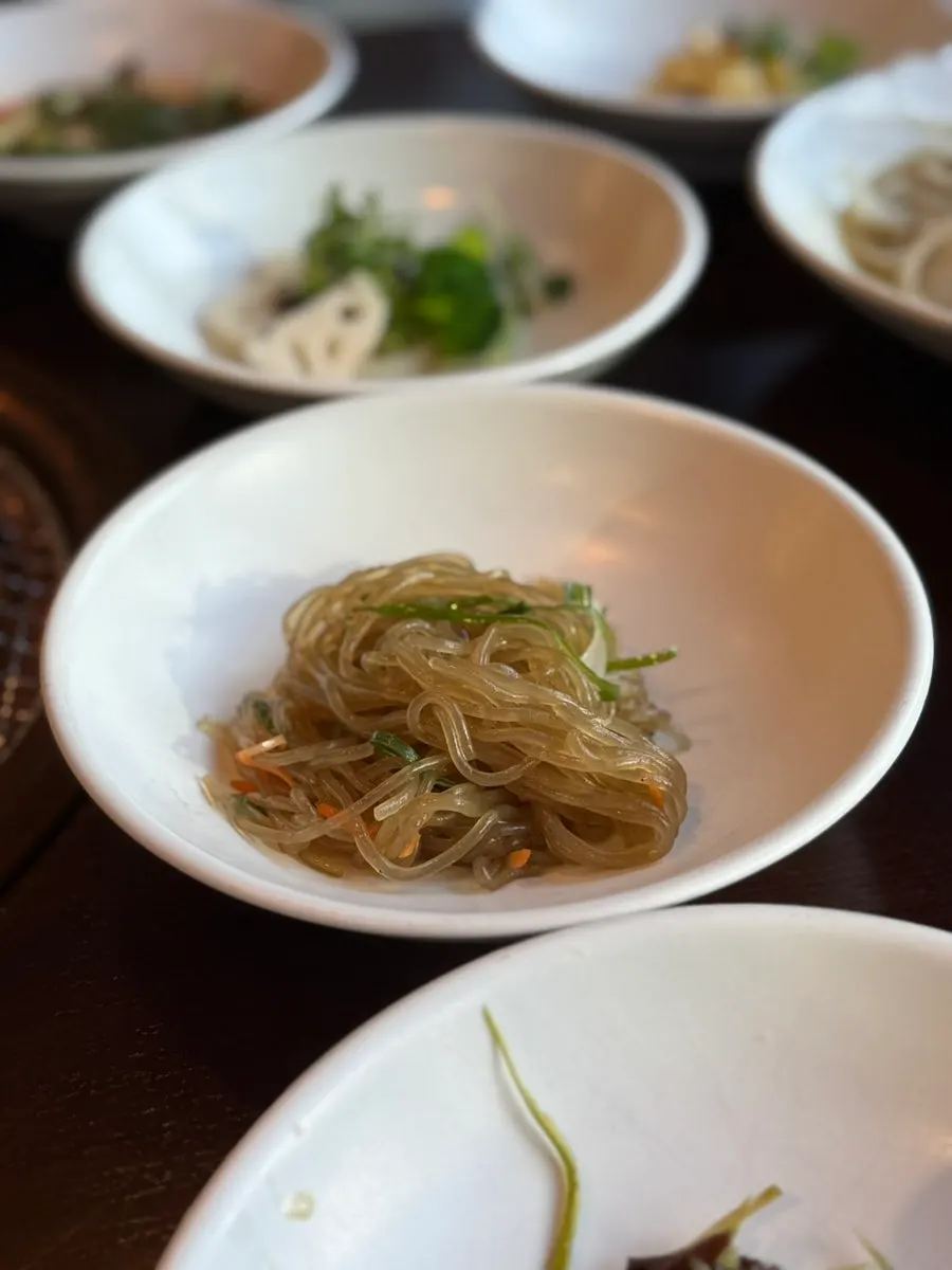 Table set with an array of side dishes at Neul Gogi Jip