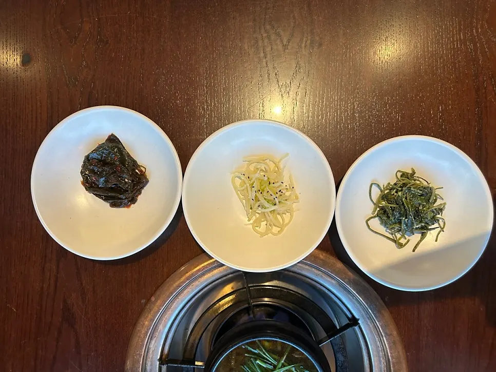 Table with 7 basic side dishes laid out