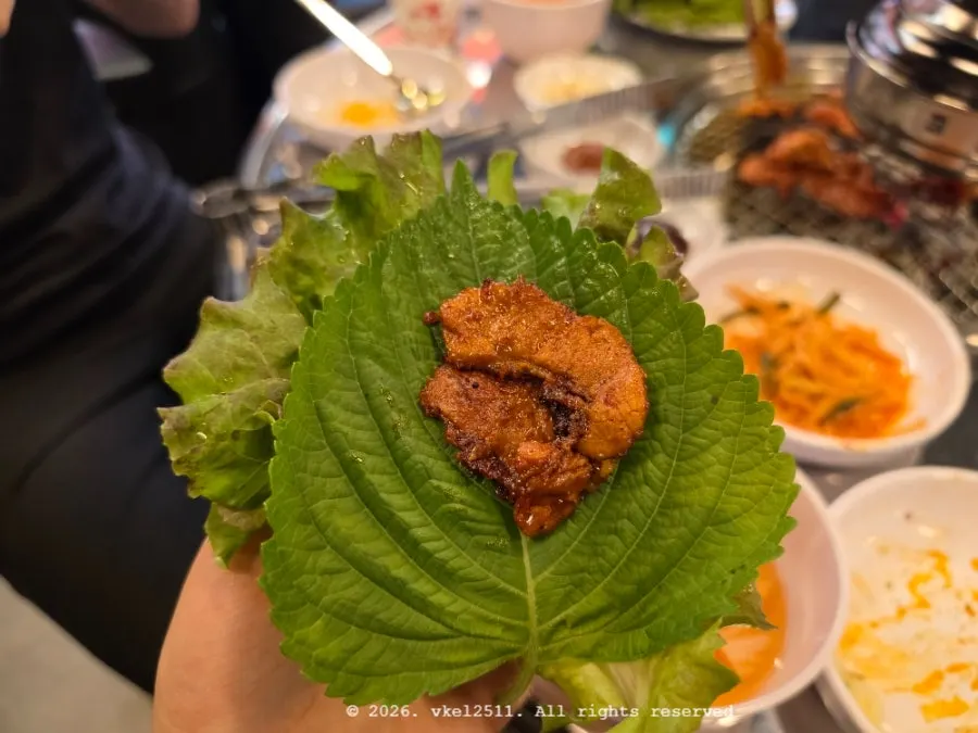 Marinated pork belly eaten with ssam vegetables