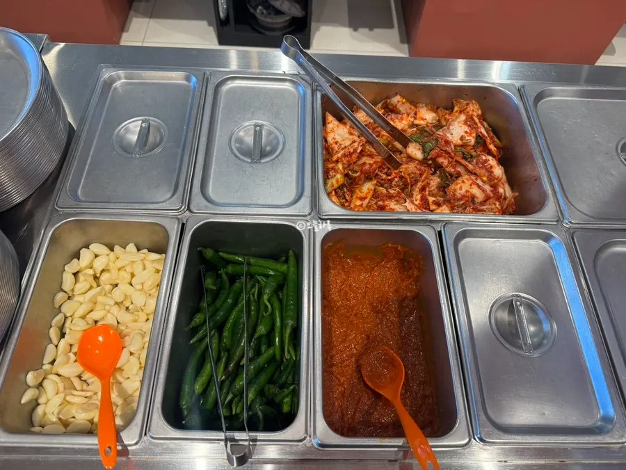 Wrap greens salad bar in the middle of the restaurant