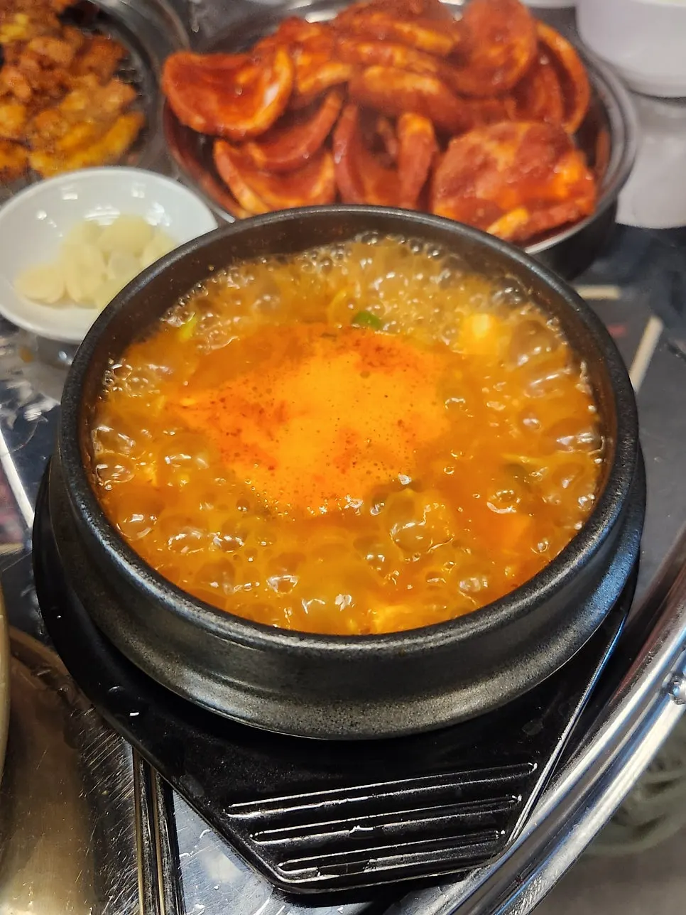 Doenjang stew served alongside bowl bibimbap