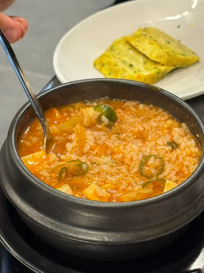 Soybean paste stew broth with a bowl of rice