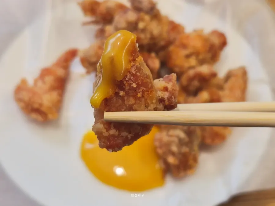 A plate of gara-age served with mustard sauce