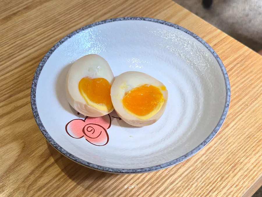 Two moist soft-boiled eggs ordered as an extra