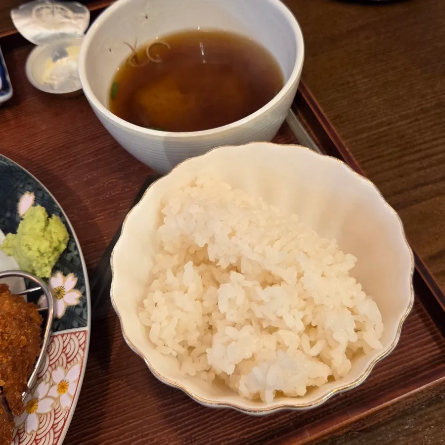 Gyukatsu set and steak set table settings side by side