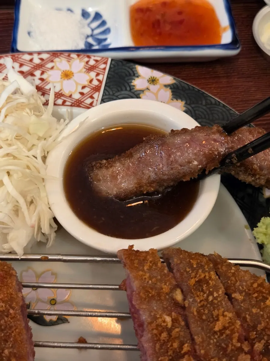 A piece of gyukatsu with sauce