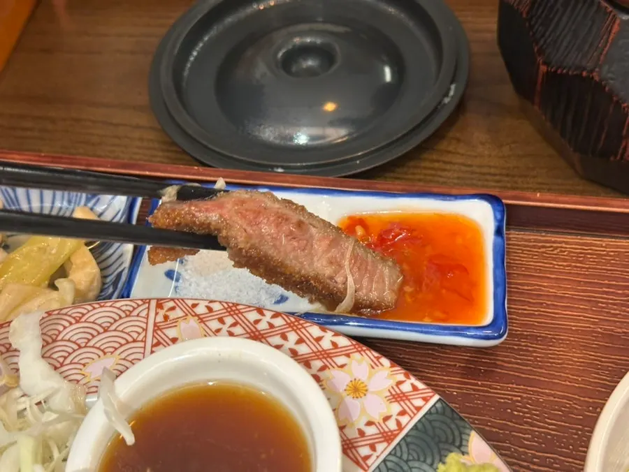 Gyukatsu dipped in house sauce with cabbage salad