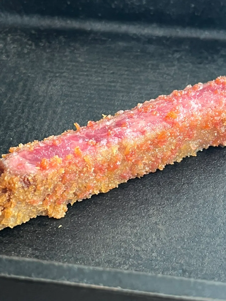 A piece of gyukatsu grilled with butter