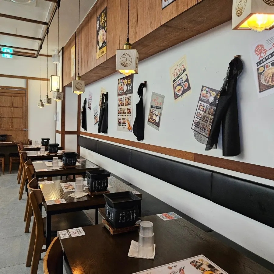 Store interior with tables for two and four