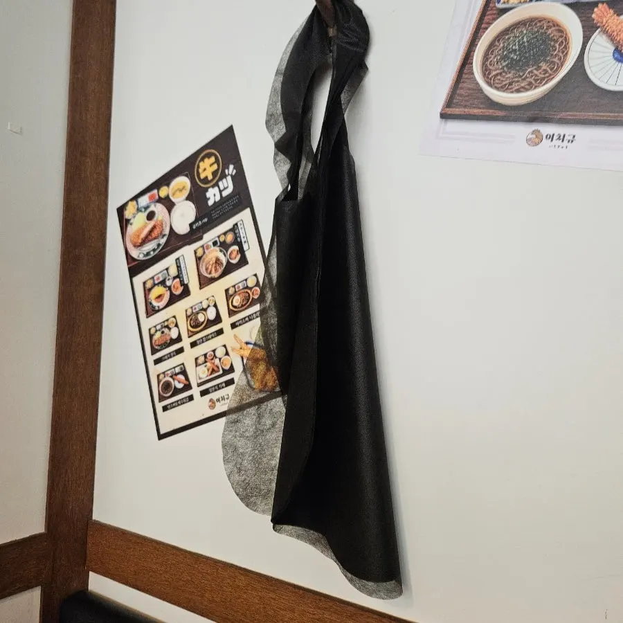 Disposable aprons hanging on the wall