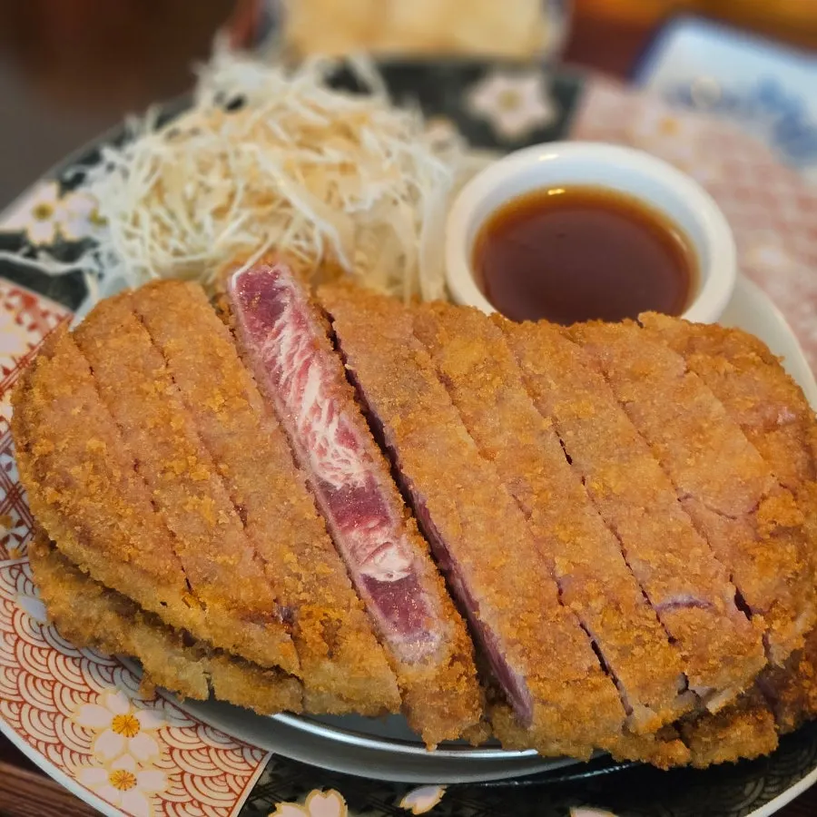 Double jumbo gyukatsu made with striploin, served on a platter