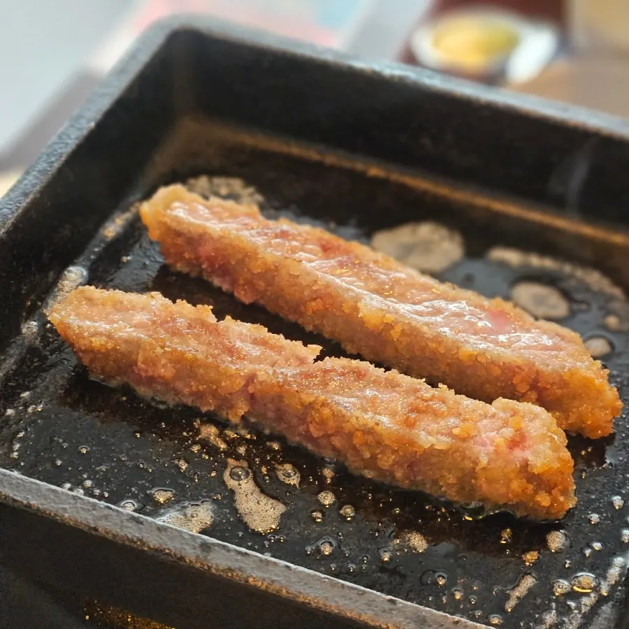 Cross-section of gyukatsu, crispy outside and moist inside