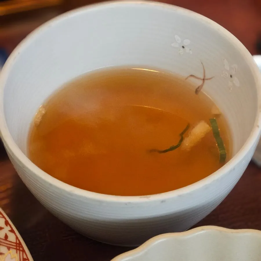 A piece of gyukatsu dipped in sauce