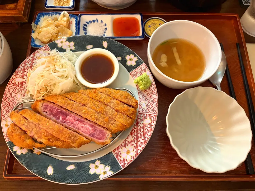 Table spread of gyukatsu, cold soba, and fried shrimp
