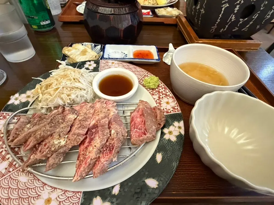 Table spread with steki-don and hamburg omurice together