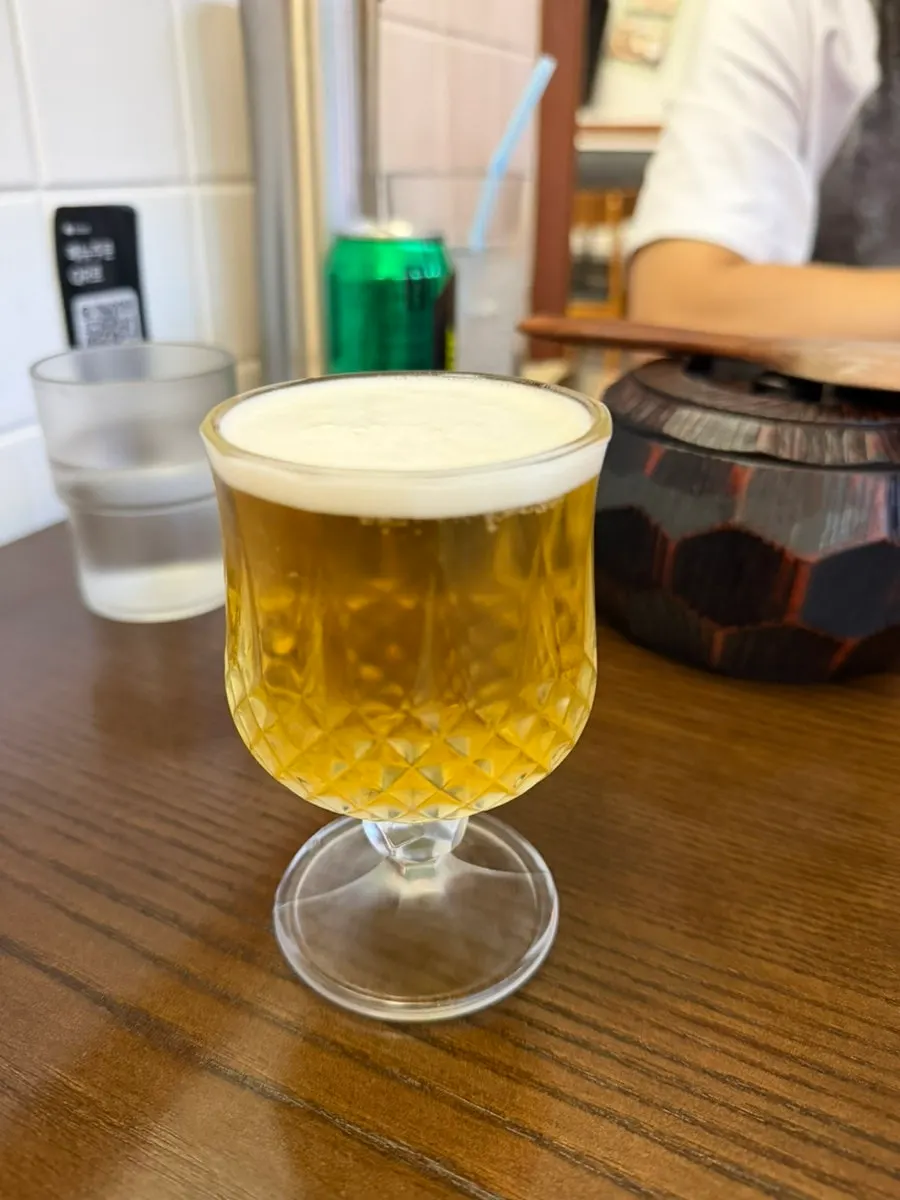 Draft beer served in a small glass
