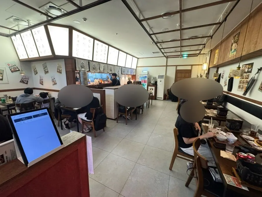Interior of Ichigyu with high ceilings and wide table spacing