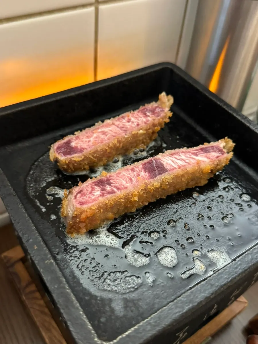 Grilling gyukatsu with butter on top