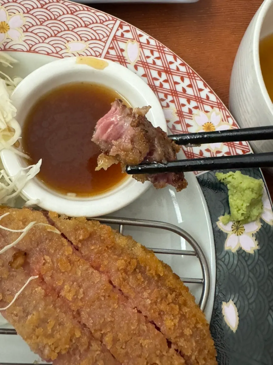 A piece of gyukatsu grilled to just the right doneness