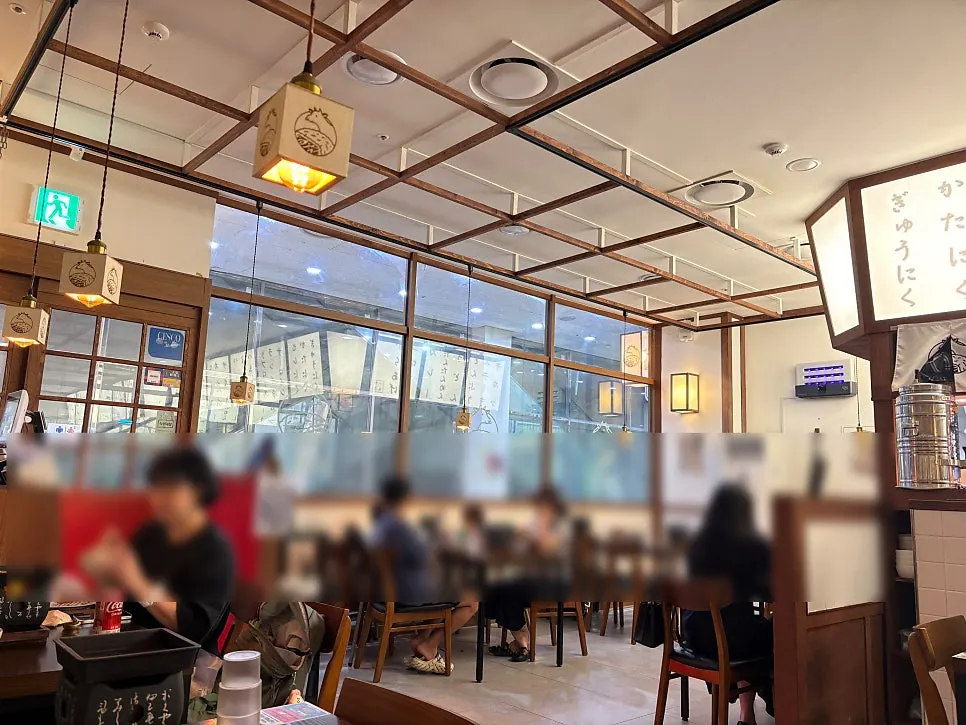 Ichigyu's dining room busy with families and solo diners