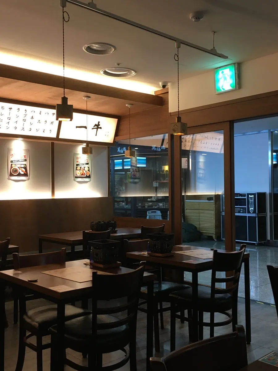 Interior of Ichigyu Seoul Station Branch with tables set up