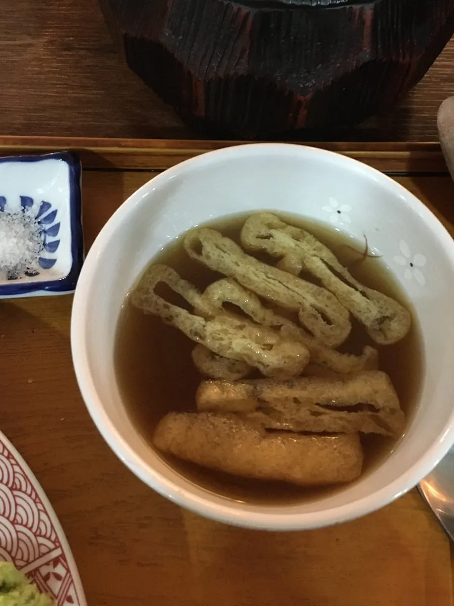 Savory soup served alongside the gyukatsu