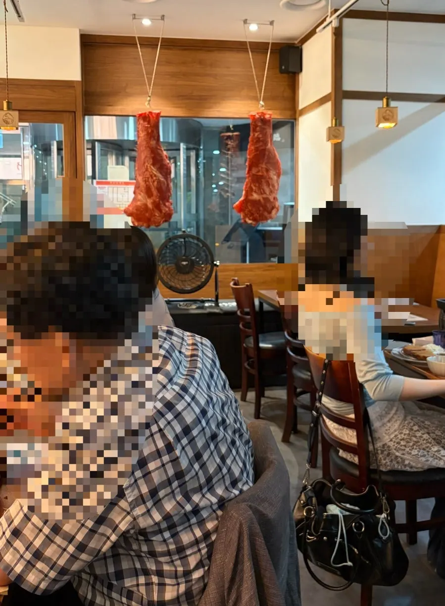 View of the dining room near the window with hanging meat
