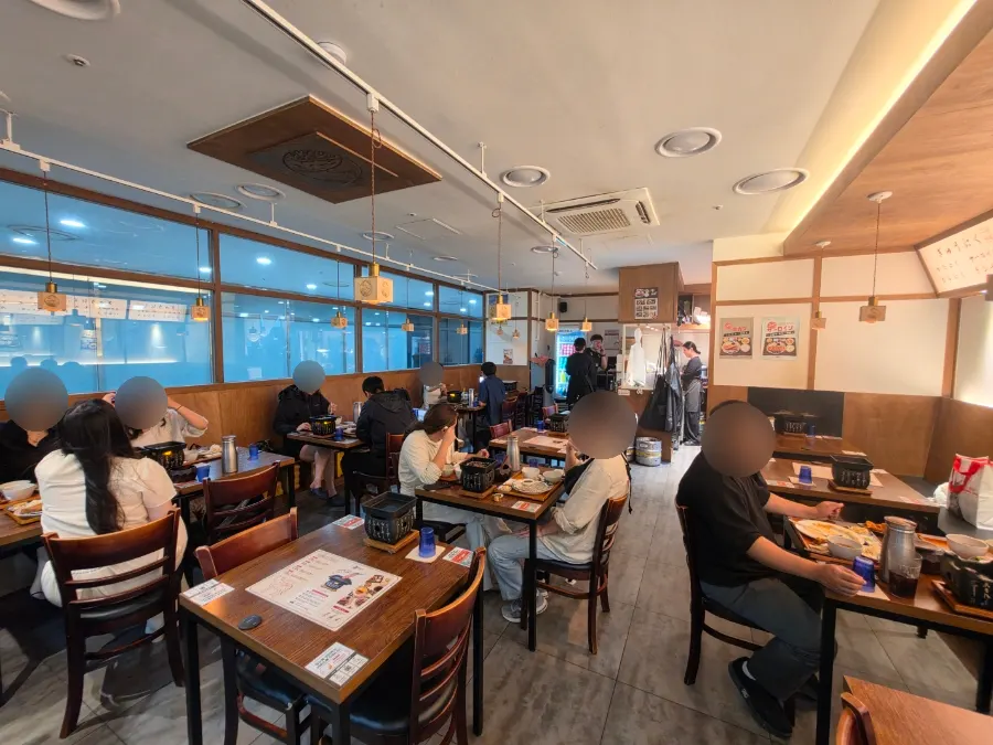 Wood-toned interior of Ichigyu Seoul Station Branch