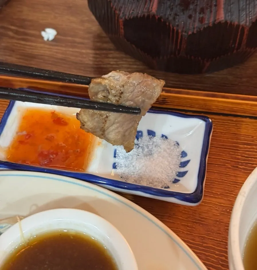 A piece of gyukatsu topped with wasabi