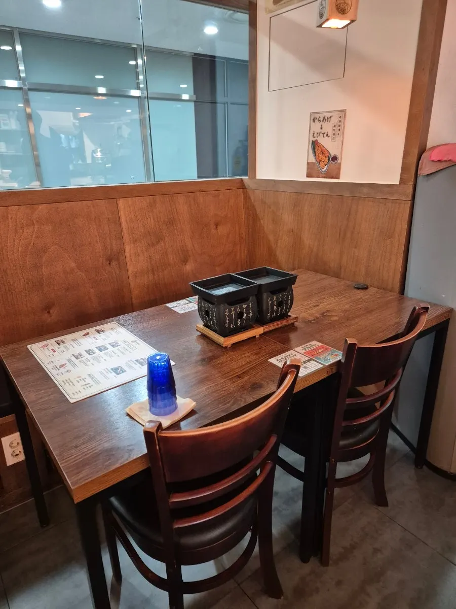 Interior of Ichigyu Seoul Station Branch with many tables