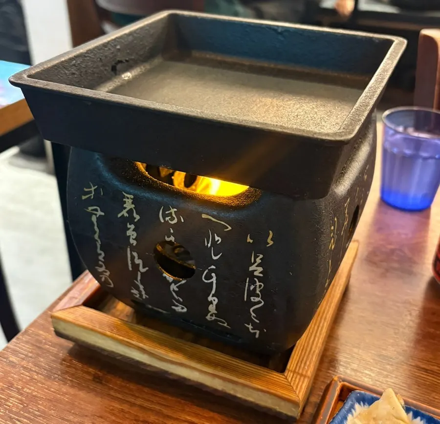 Personal brazier for grilling gyukatsu set up at the table
