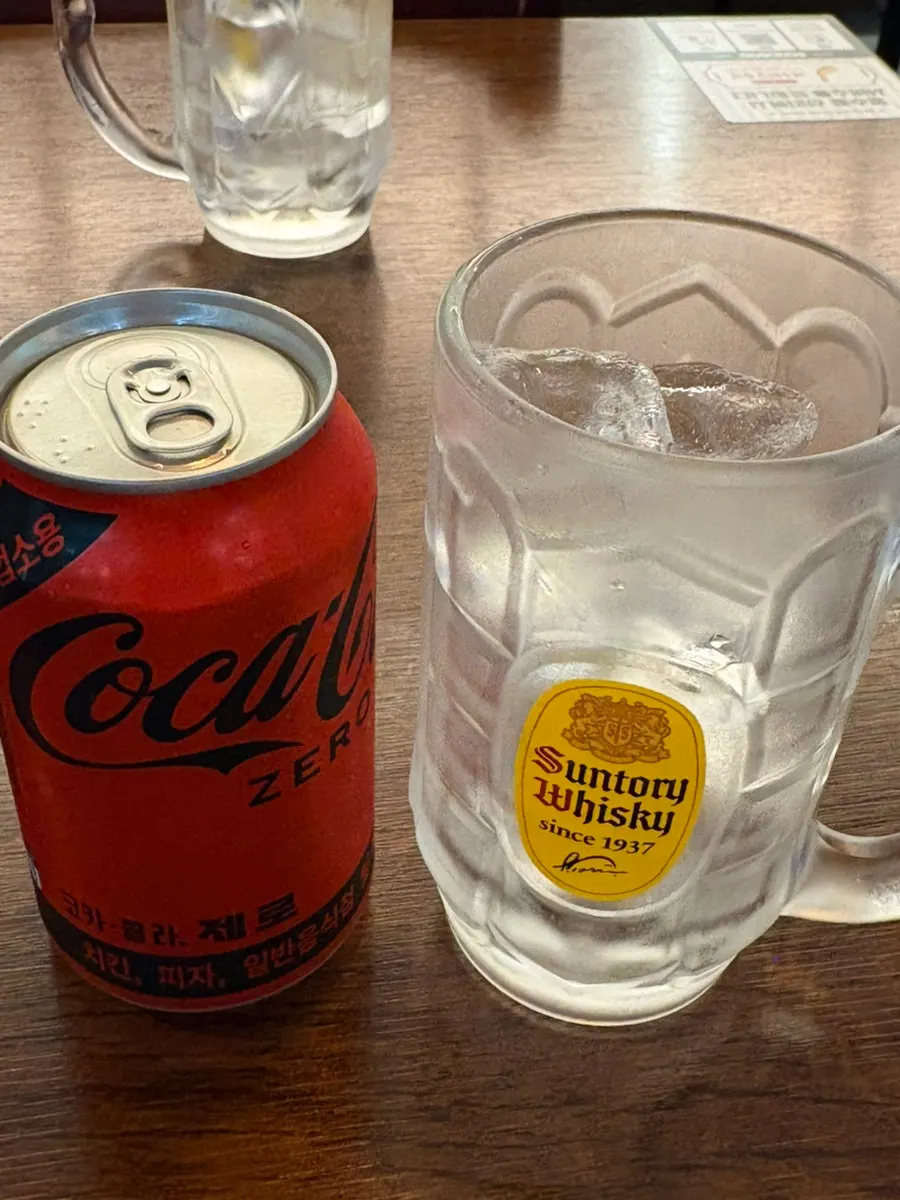 Cola served with a cup of ice