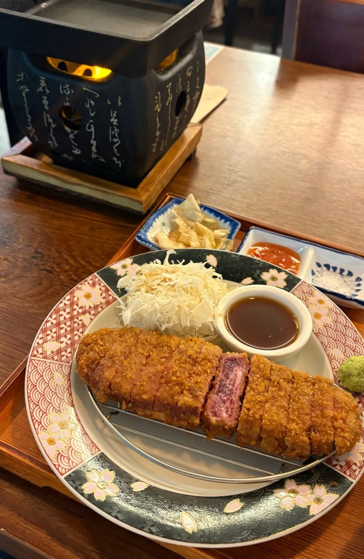 Table set with the brazier, gyukatsu, and omurice