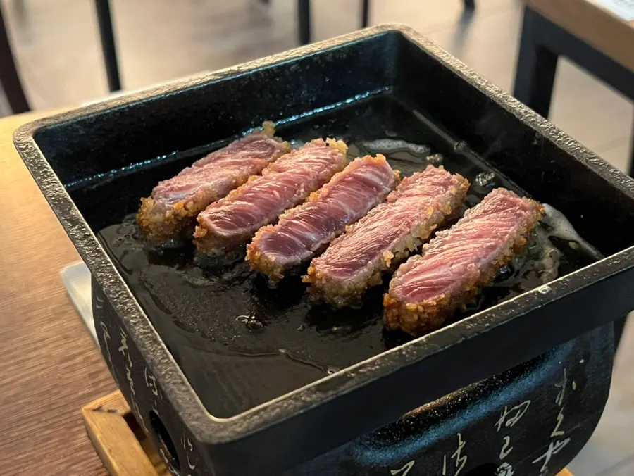 A piece of gyukatsu grilled medium-rare