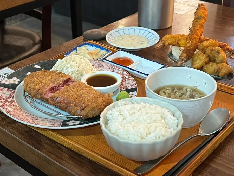 A table with gyukatsu and side dishes laid out together