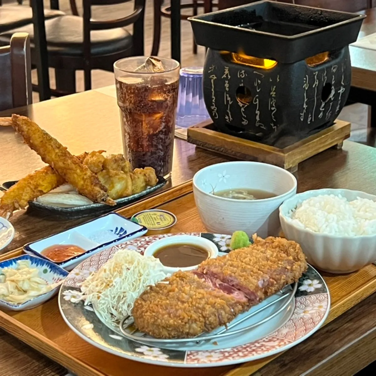Signature shot of grilled gyukatsu on the tabletop stove