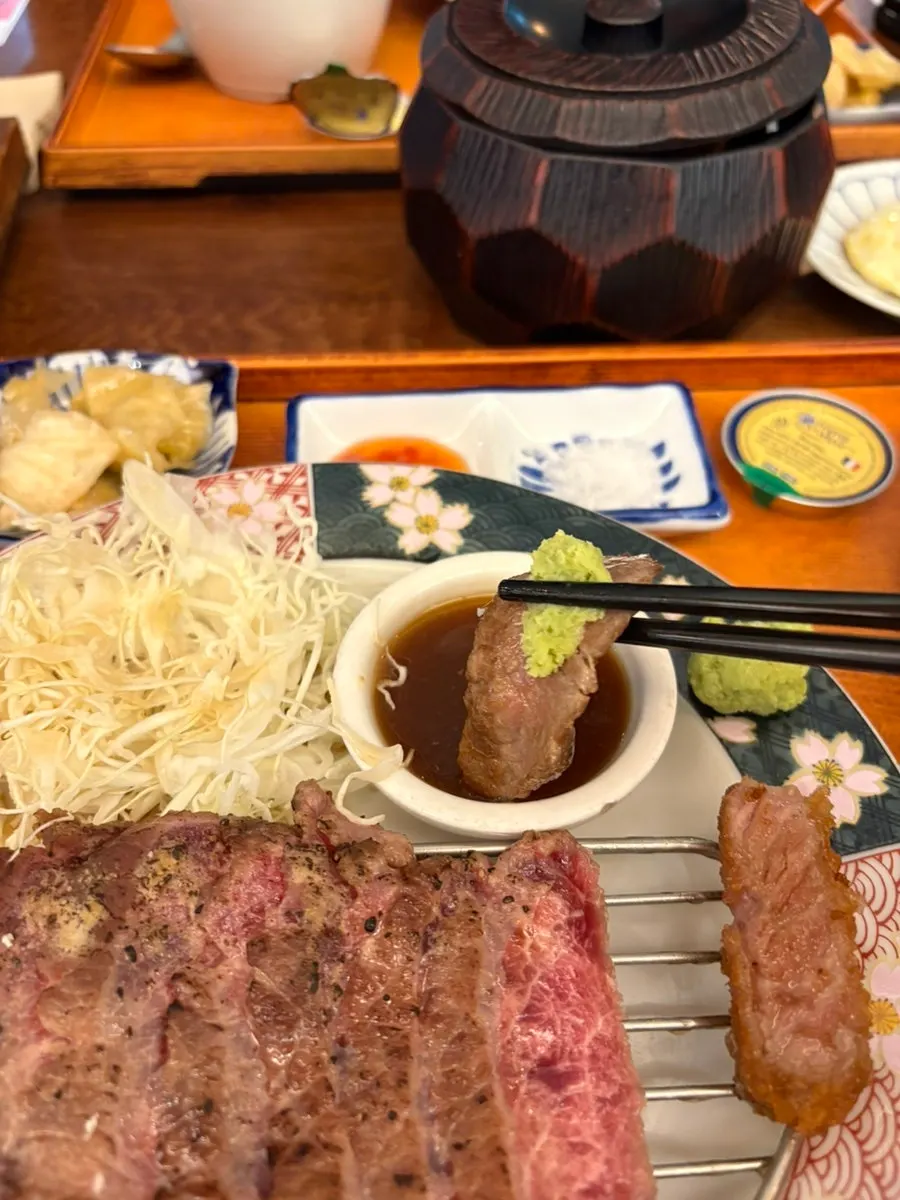 Meat served with fresh wasabi, salt, and steak sauce