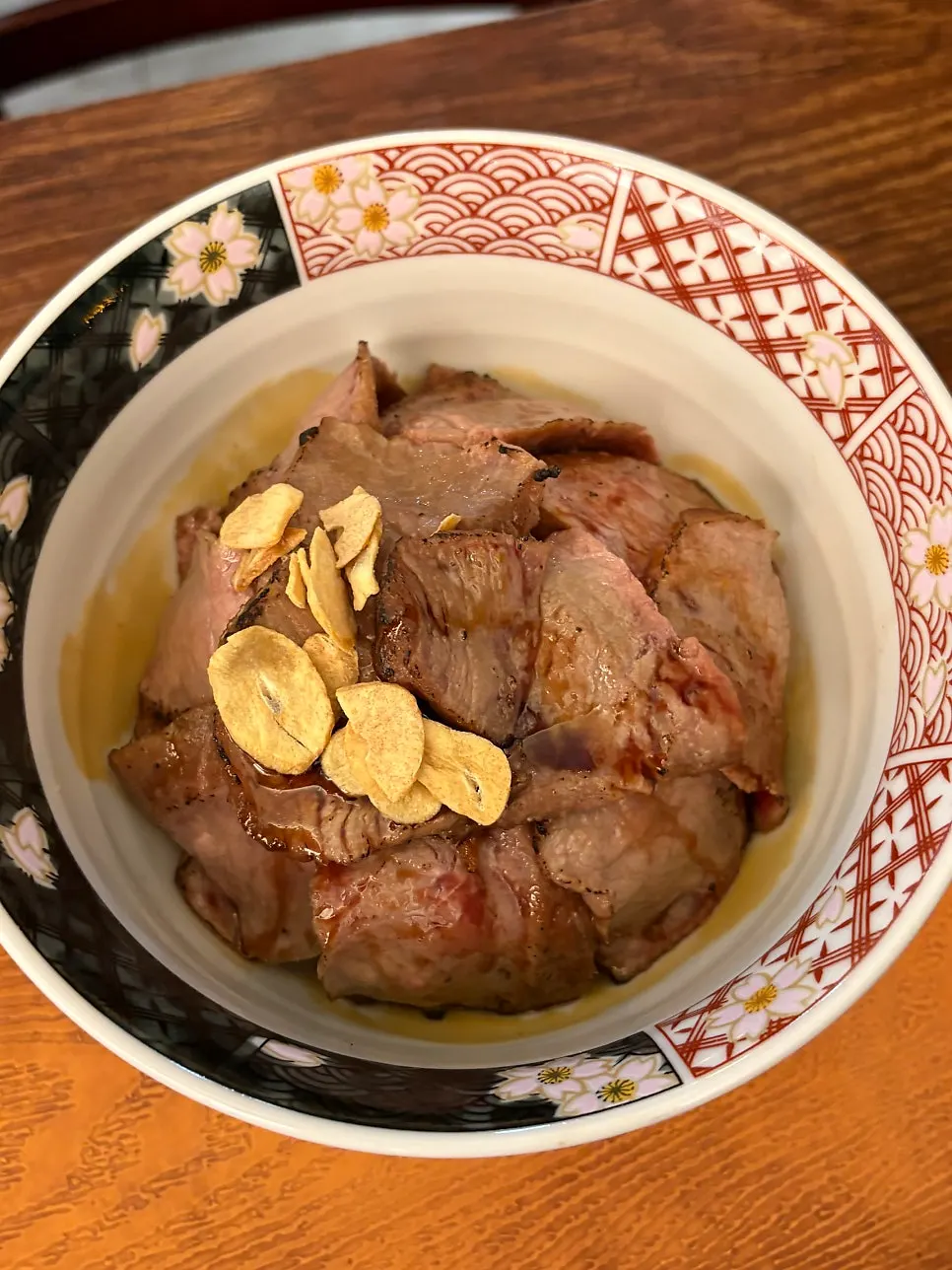 Ichigyu steak-don topped with garlic flakes