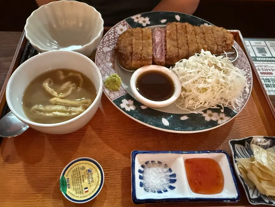 Personal brazier on the table with rare-cooked meat