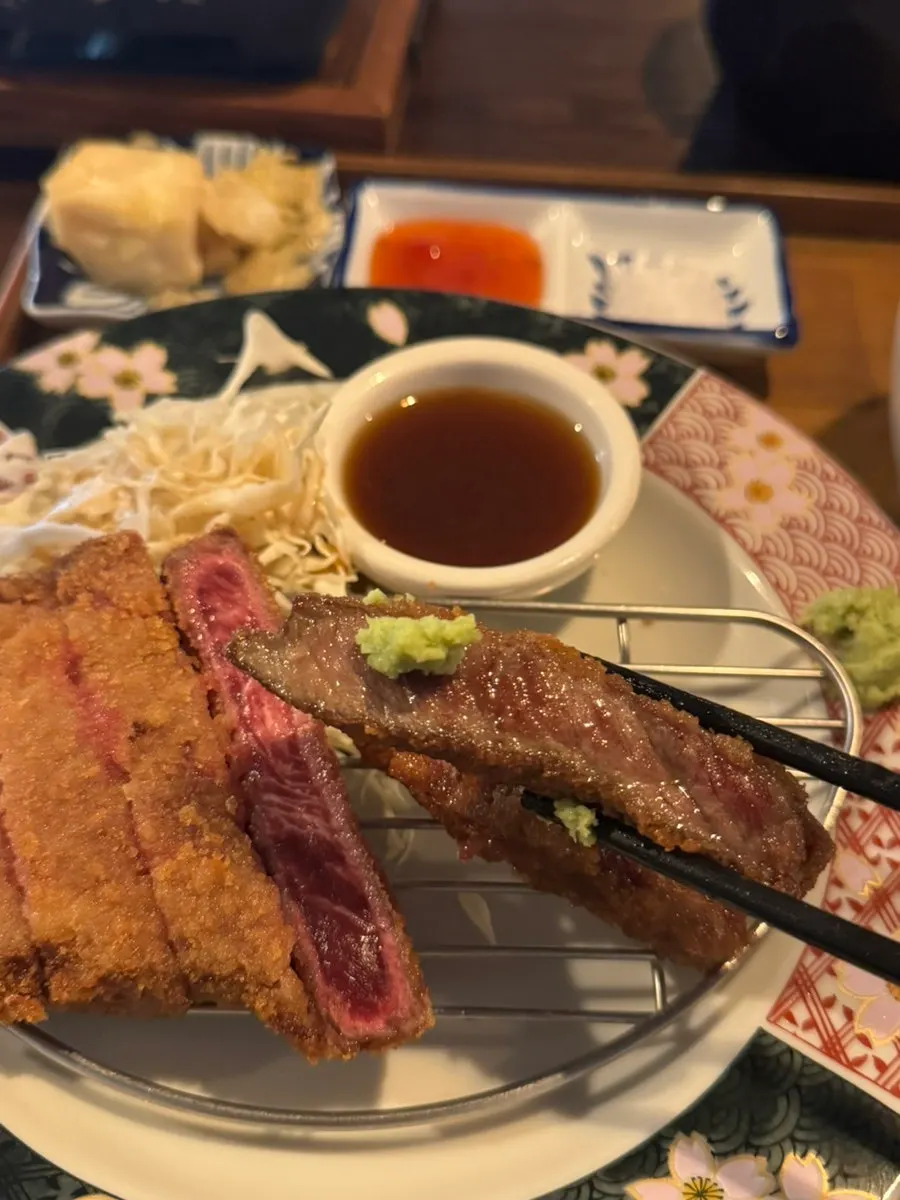 Gyukatsu table spread with salt and sauce on the side