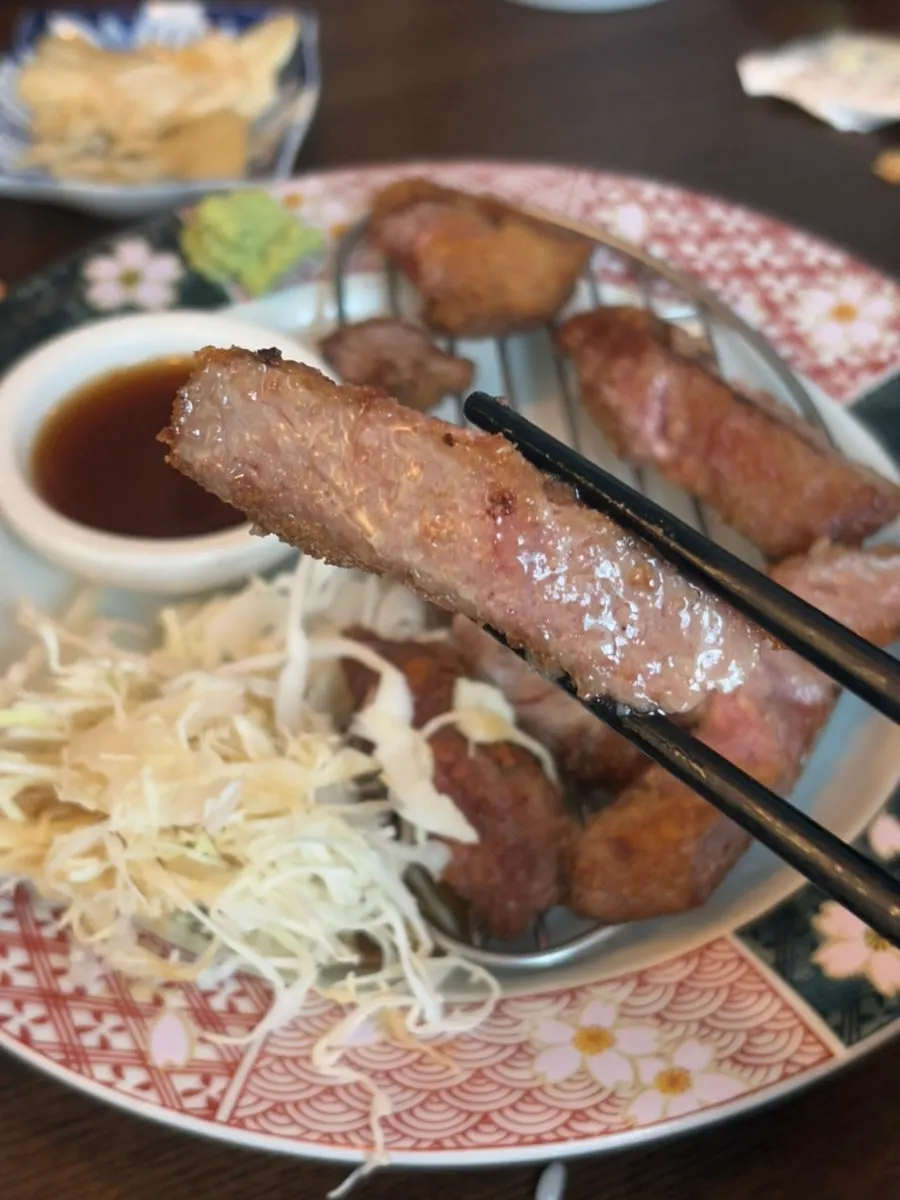 Cross-section of gyukatsu dipped in special sauce