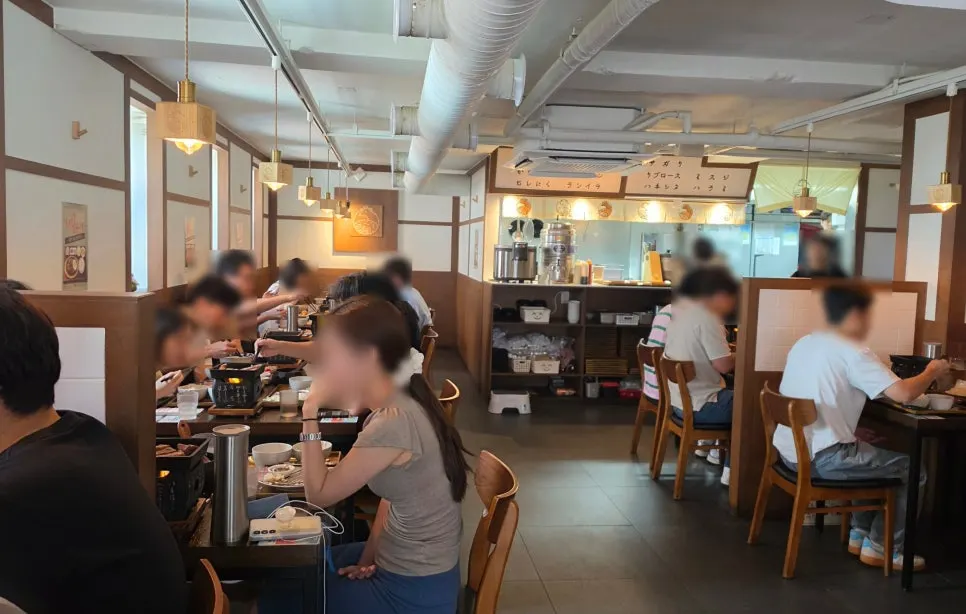 Restaurant interior packed with customers during lunch peak